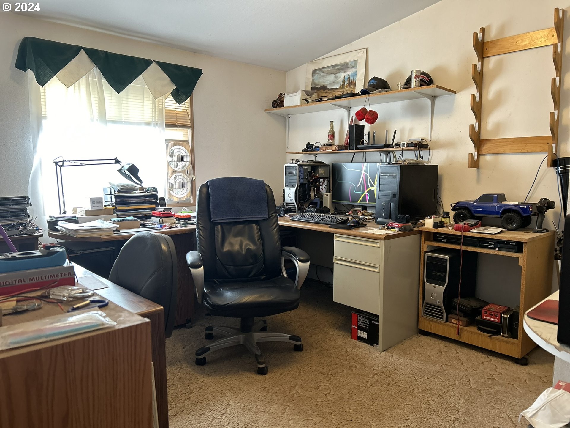 5391 Buckskin Bob Road Florence, OR 97439 - Photo 16 of 42 a room with a workspace and a window