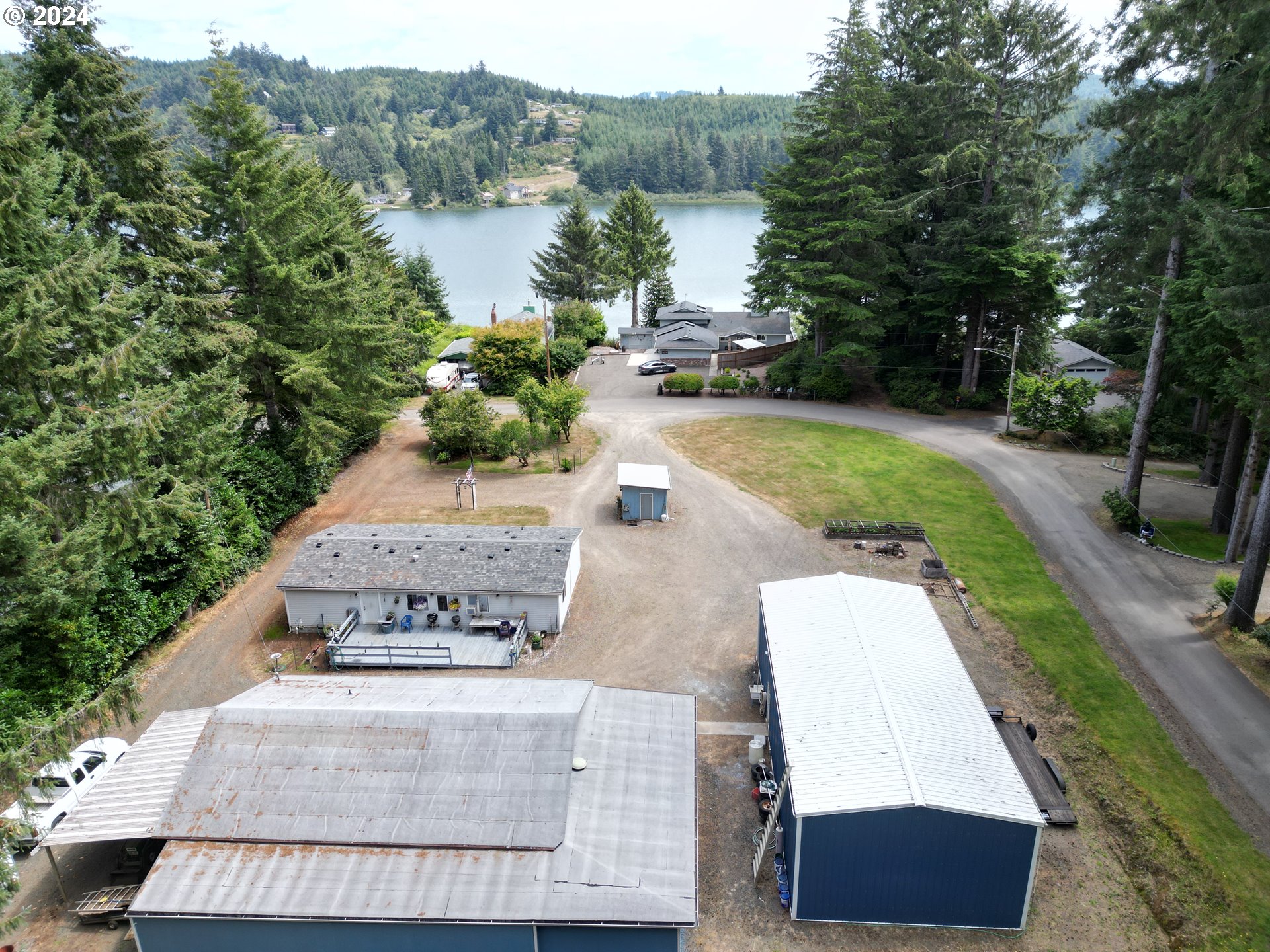 5391 Buckskin Bob Road Florence, OR 97439 - Photo 2 of 42 a view of a yard with swimming pool