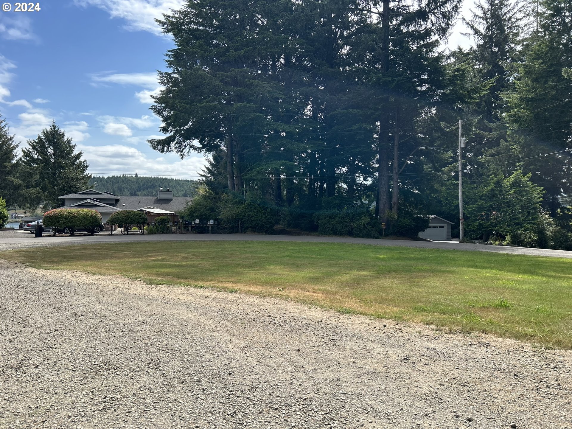 5391 Buckskin Bob Road Florence, OR 97439 - Photo 27 of 42 a view of yard with swimming pool and green space