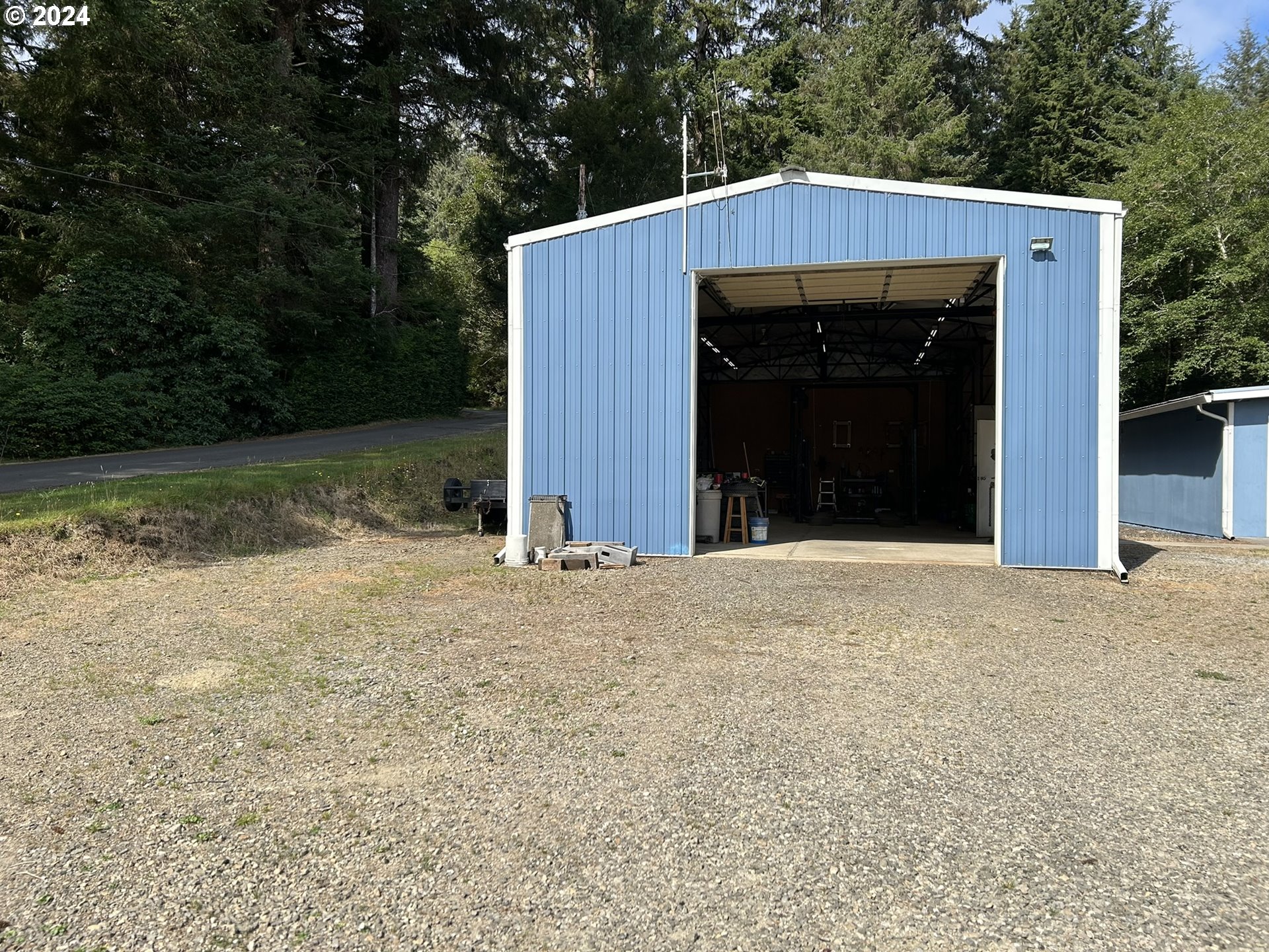 5391 Buckskin Bob Road Florence, OR 97439 - Photo 30 of 42 a view of a house with backyard and trees