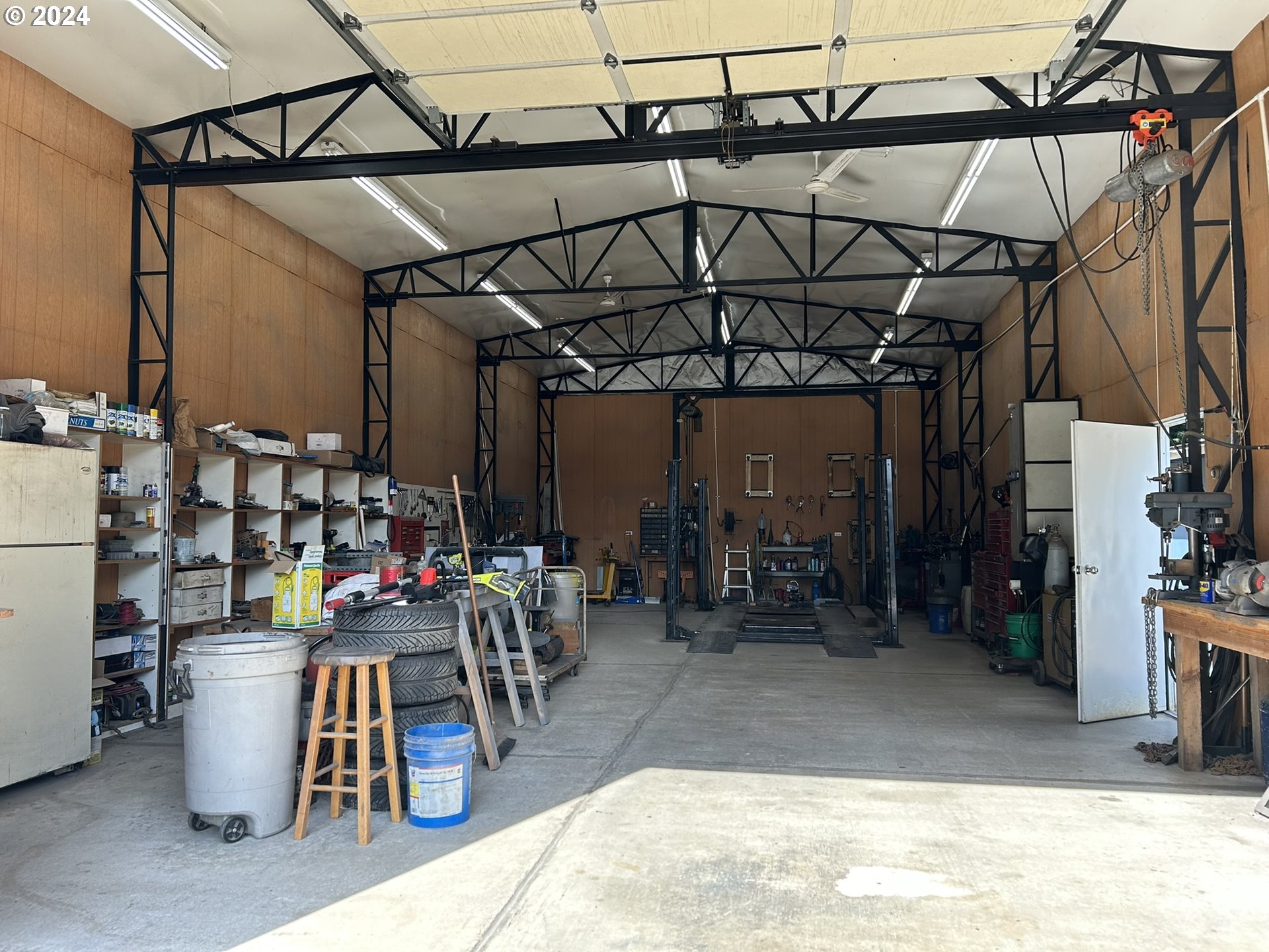 5391 Buckskin Bob Road Florence, OR 97439 - Photo 31 of 42 a view of a storage room with a lot of stuff