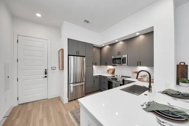 a living room with furniture and a table