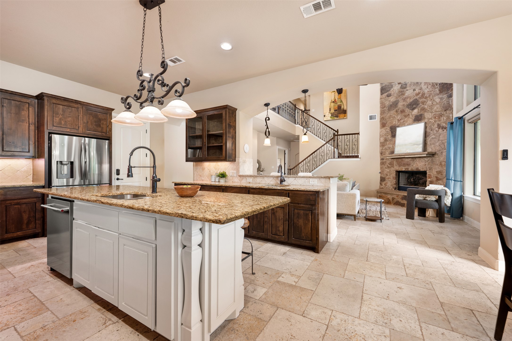 1102 Paw Print Leander, TX 78641 - Photo 16 of 40 This kitchen features a large island with a sink and a granite countertop
