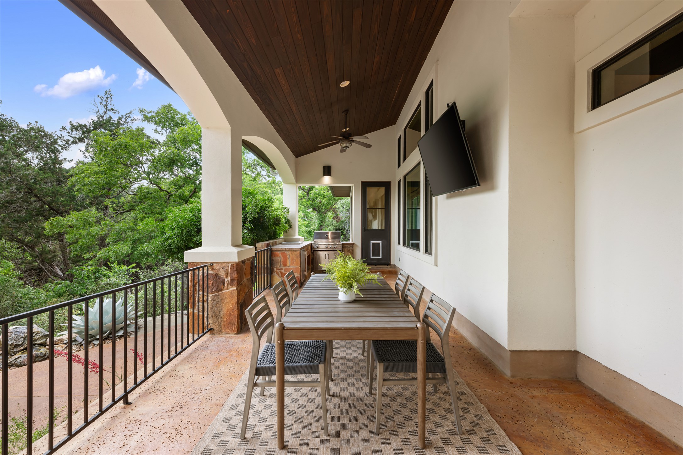 1102 Paw Print Leander, TX 78641 - Photo 26 of 40 The property features an expansive covered patio with a wooden ceiling, a ceiling fan, and recessed lighting