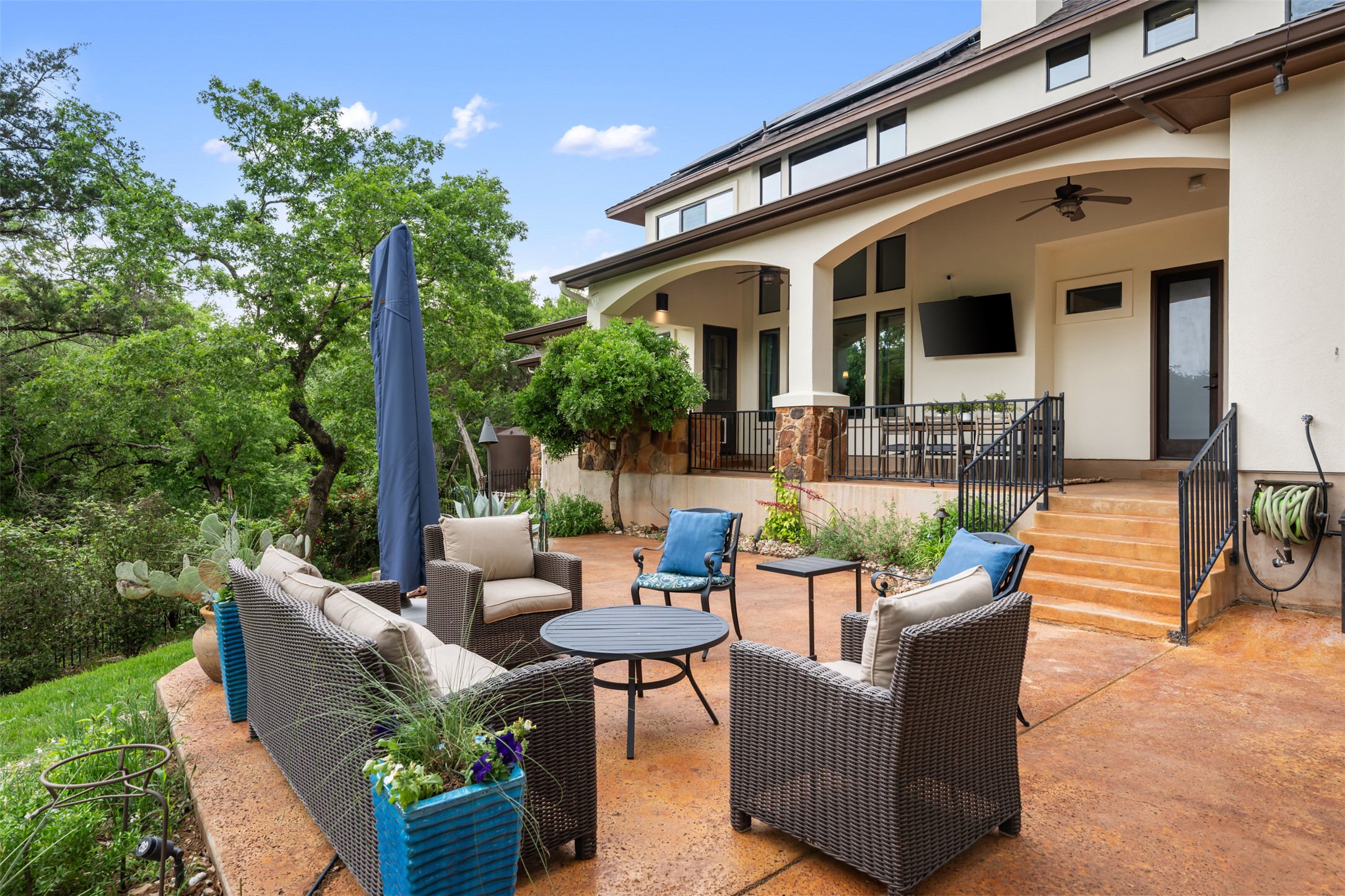 1102 Paw Print Leander, TX 78641 - Photo 30 of 40 This property features an expansive outdoor patio area with a concrete surface, offering ample space for outdoor seating