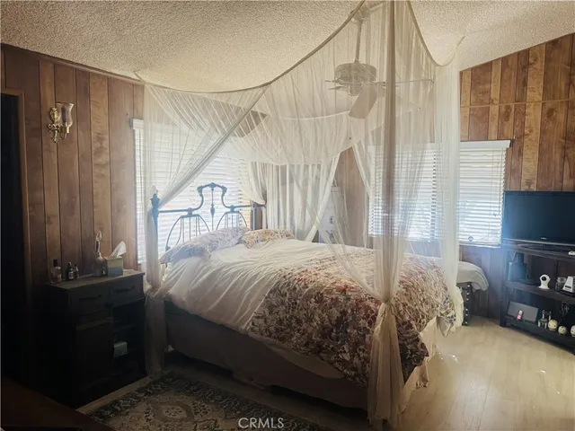 a room with a bed and a mirror