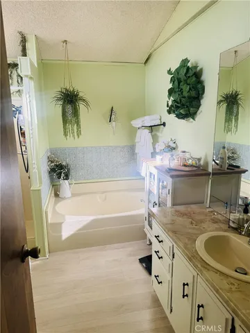 a bathroom with a tub and a shower