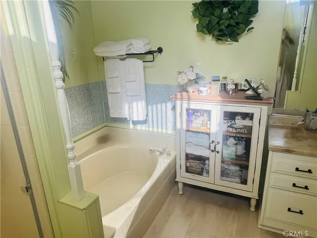 a bathroom with a shower and a mirror