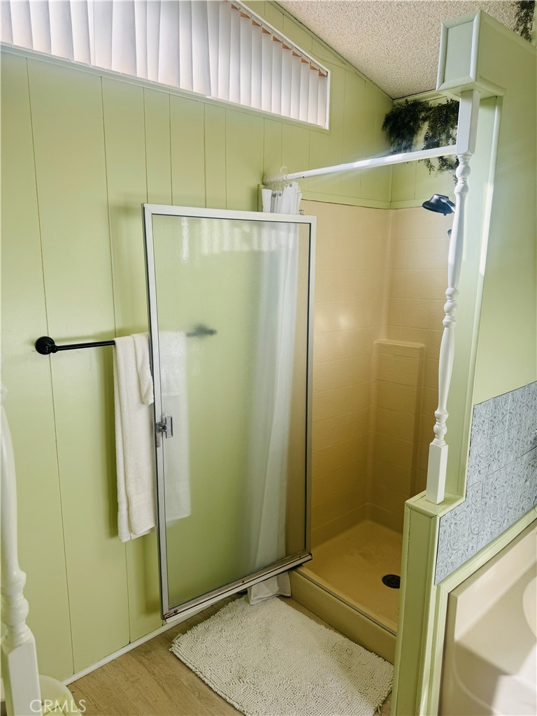 4133 West Wilson Street, Unit 169 Banning, CA 92220 - Photo 19 of 37 a bathroom with a shower and a mirror