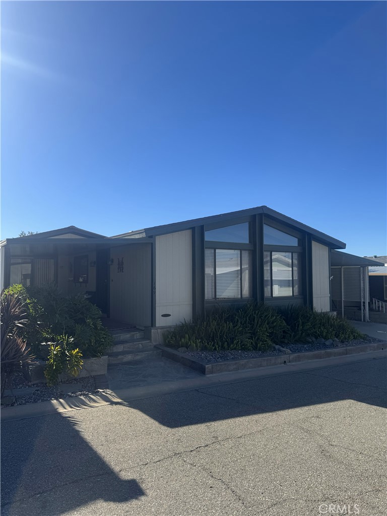 4133 West Wilson Street, Unit 169 Banning, CA 92220 - Photo 2 of 37 a house view with a outdoor space