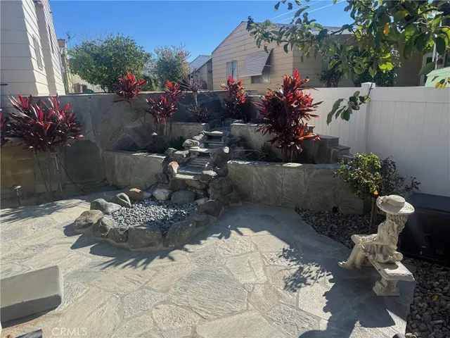 a view of a backyard of the house