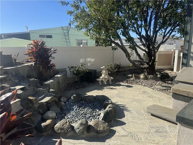 a view of a backyard with sitting area