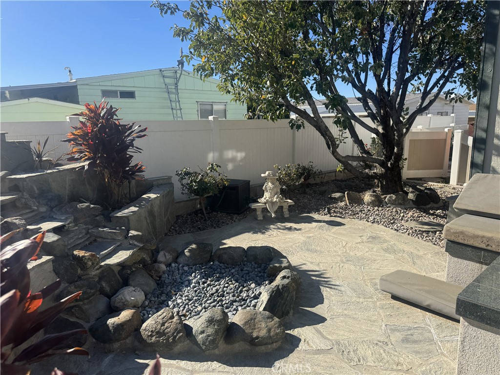 4133 West Wilson Street, Unit 169 Banning, CA 92220 - Photo 27 of 37 a view of a backyard of the house