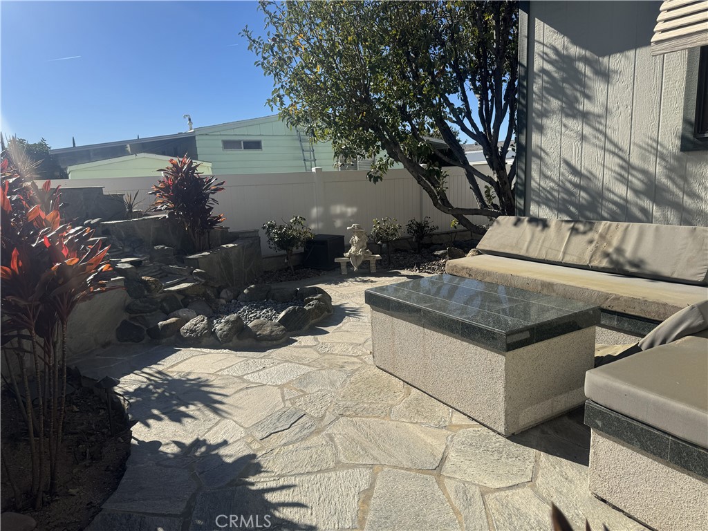 4133 West Wilson Street, Unit 169 Banning, CA 92220 - Photo 28 of 37 a view of a backyard with sitting area