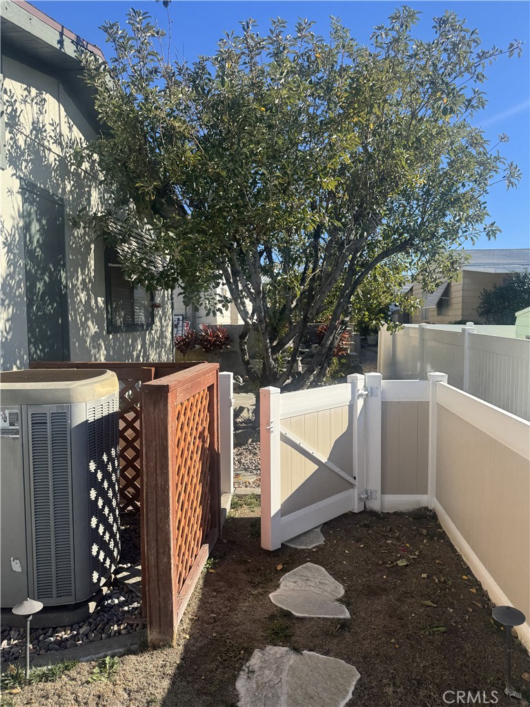 4133 West Wilson Street, Unit 169 Banning, CA 92220 - Photo 31 of 37 a view of house entrance and trees