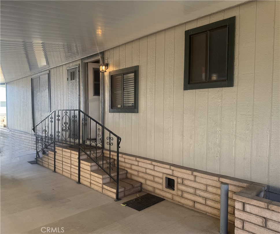 4133 West Wilson Street, Unit 169 Banning, CA 92220 - Photo 34 of 37 a view of a hallway with entryway