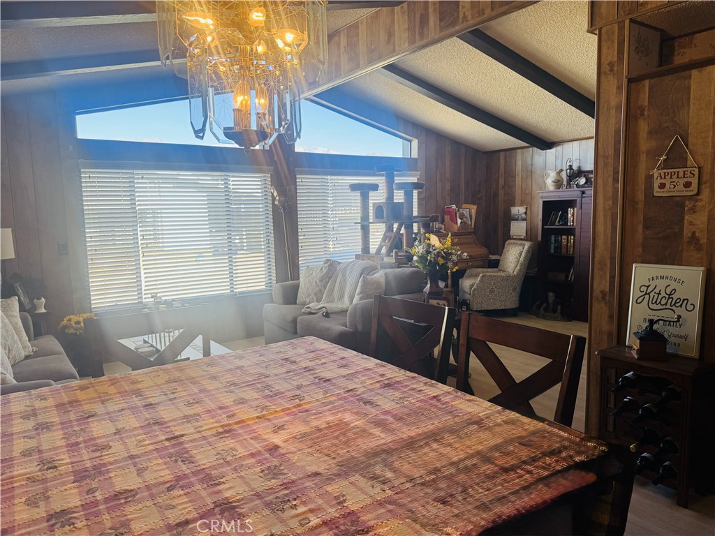 4133 West Wilson Street, Unit 169 Banning, CA 92220 - Photo 7 of 37 a bedroom with a bed and wooden floor