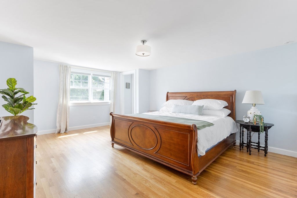 5 Mayflower Road Needham, MA 02492 - Photo 11 of 30 a spacious bedroom with a bed and a window