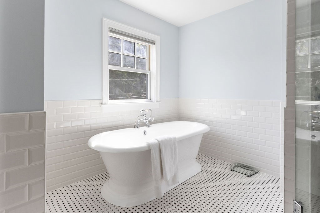 5 Mayflower Road Needham, MA 02492 - Photo 13 of 30 a white bath tub sitting next to a white sink