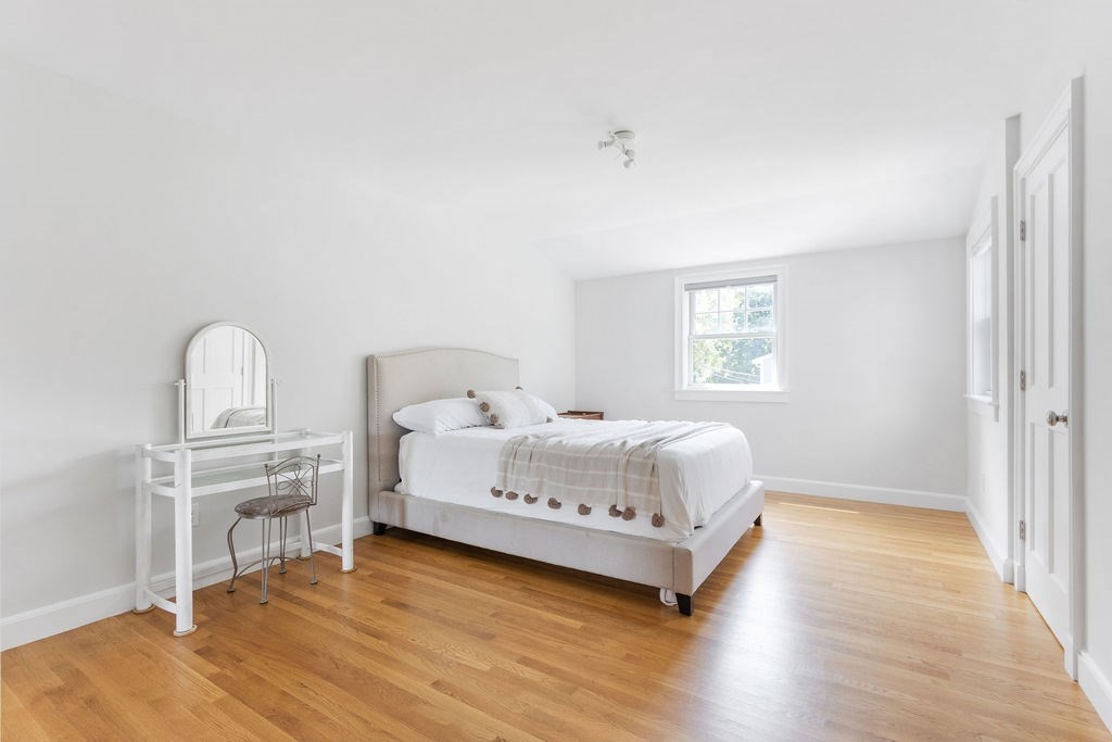 5 Mayflower Road Needham, MA 02492 - Photo 14 of 30 a bedroom with a bed and a window