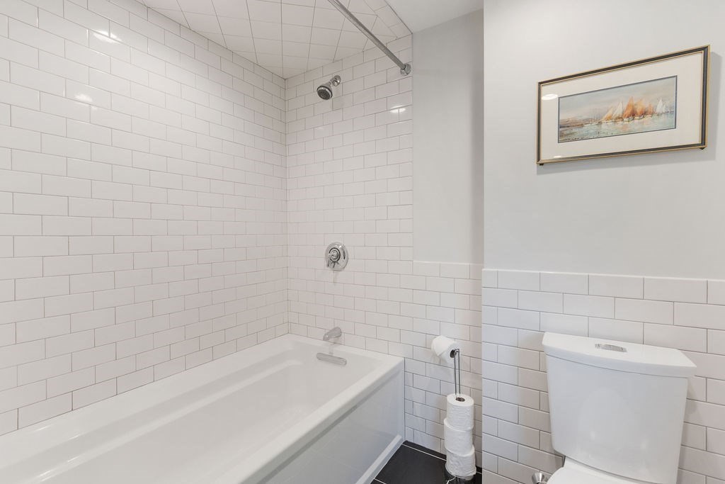 5 Mayflower Road Needham, MA 02492 - Photo 19 of 30 a bathroom with a toilet and a bathtub