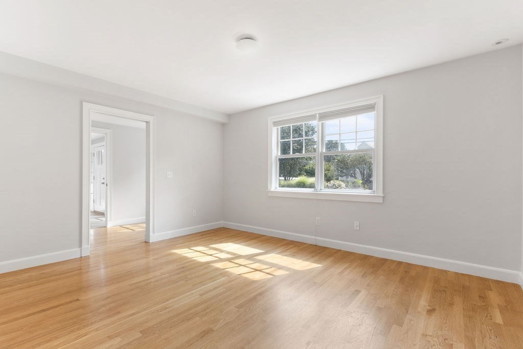 5 Mayflower Road Needham, MA 02492 - Photo 26 of 30 an empty room with wooden floor and windows