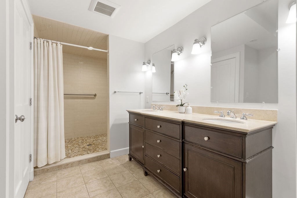 5 Mayflower Road Needham, MA 02492 - Photo 27 of 30 a bathroom with a double vanity sink mirror and double