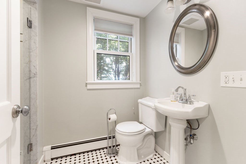 5 Mayflower Road Needham, MA 02492 - Photo 10 of 30 a bathroom with a sink a mirror and a toilet
