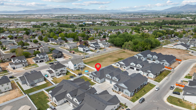 531 North Legend Way West, Unit D Mapleton, UT 84664 - Photo 32 of 42 Aerial view of property's location featuring a mountainous background and nearby suburban area