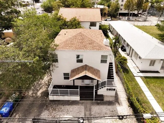 an aerial view of a house with swimming pool