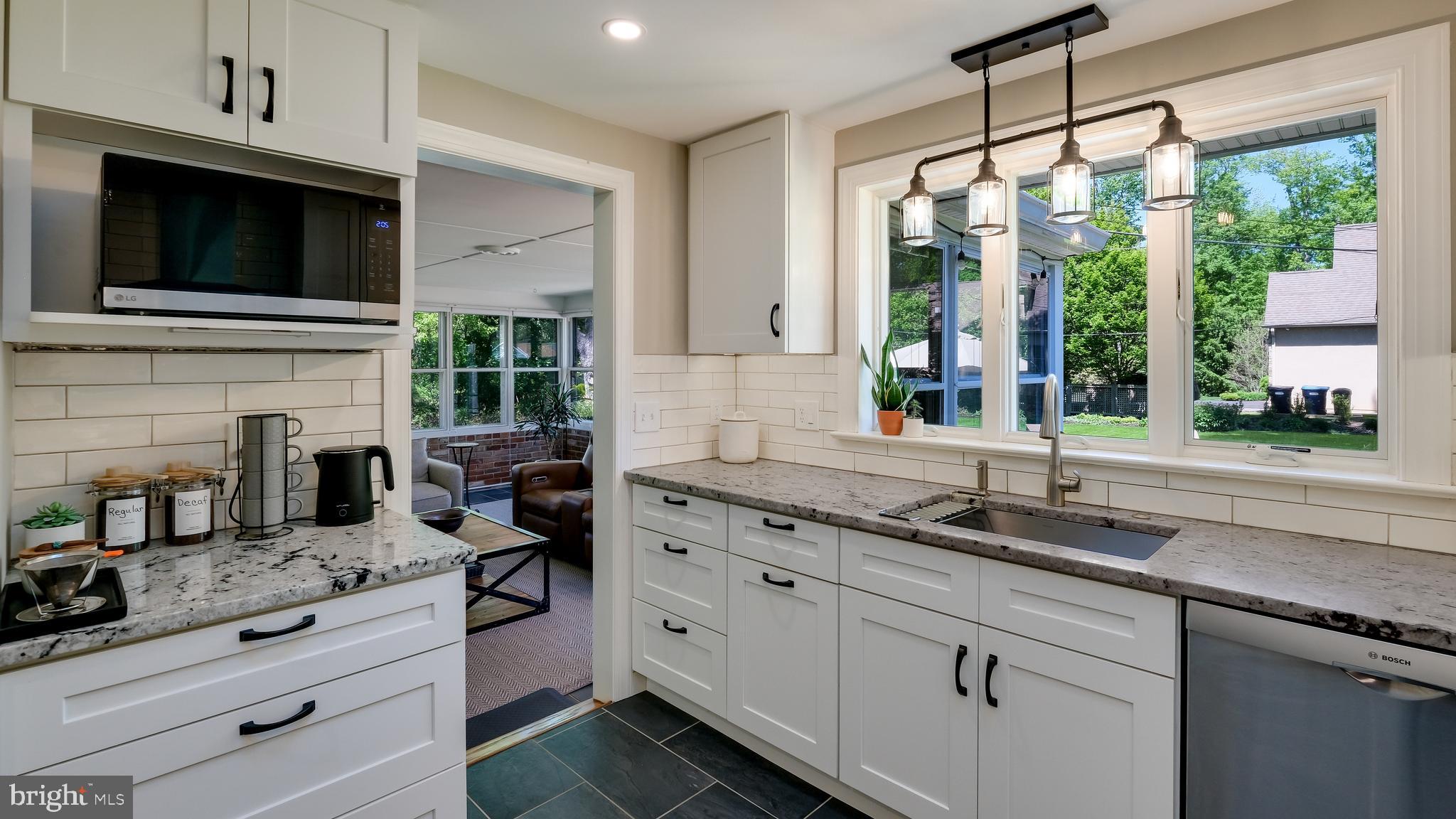 235 North Clinton Street Doylestown, PA 18901 - Photo 21 of 55 a kitchen with granite countertop a sink stainless steel appliances and cabinets