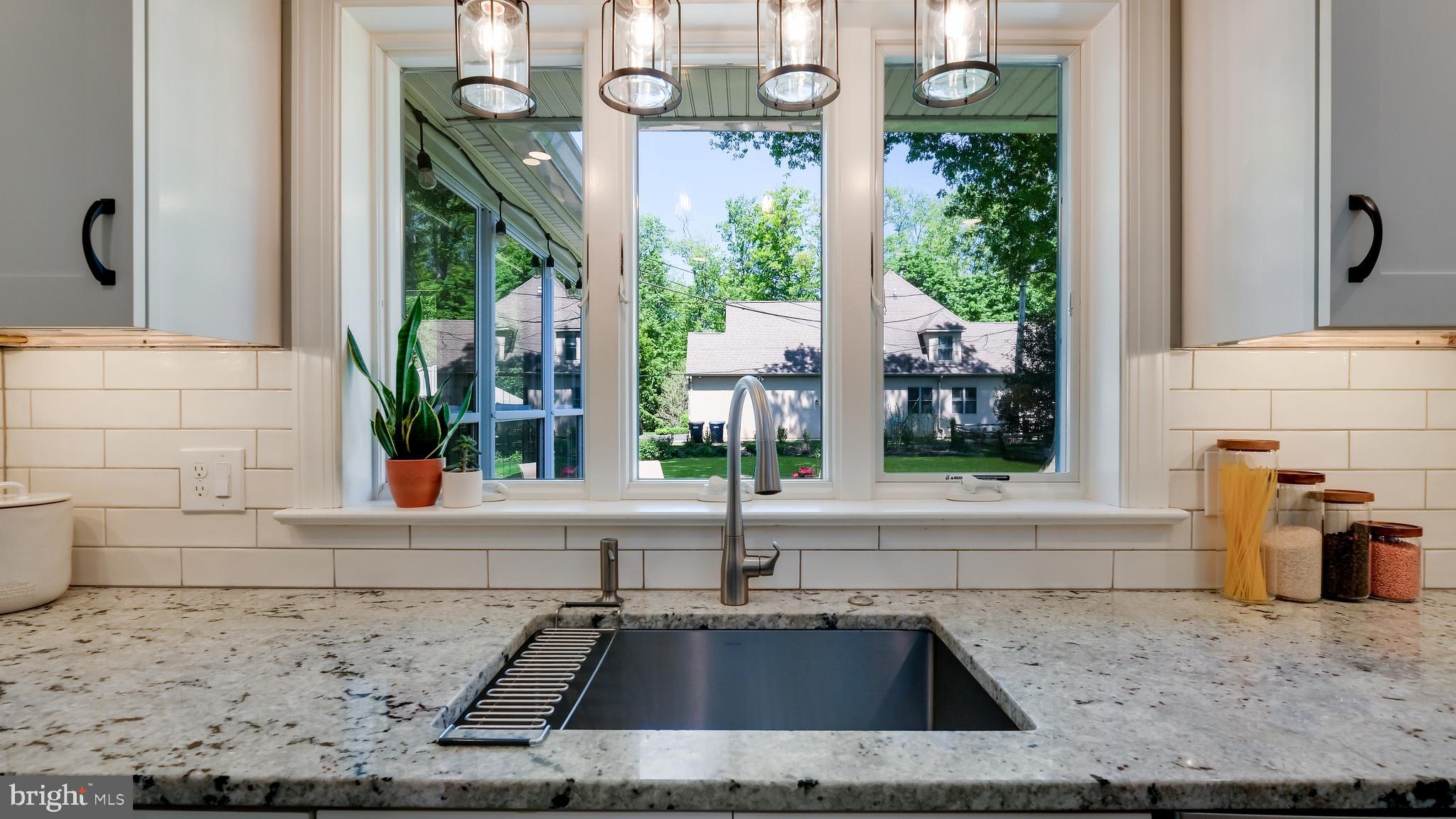 235 North Clinton Street Doylestown, PA 18901 - Photo 25 of 55 a kitchen with a sink and a stove top oven
