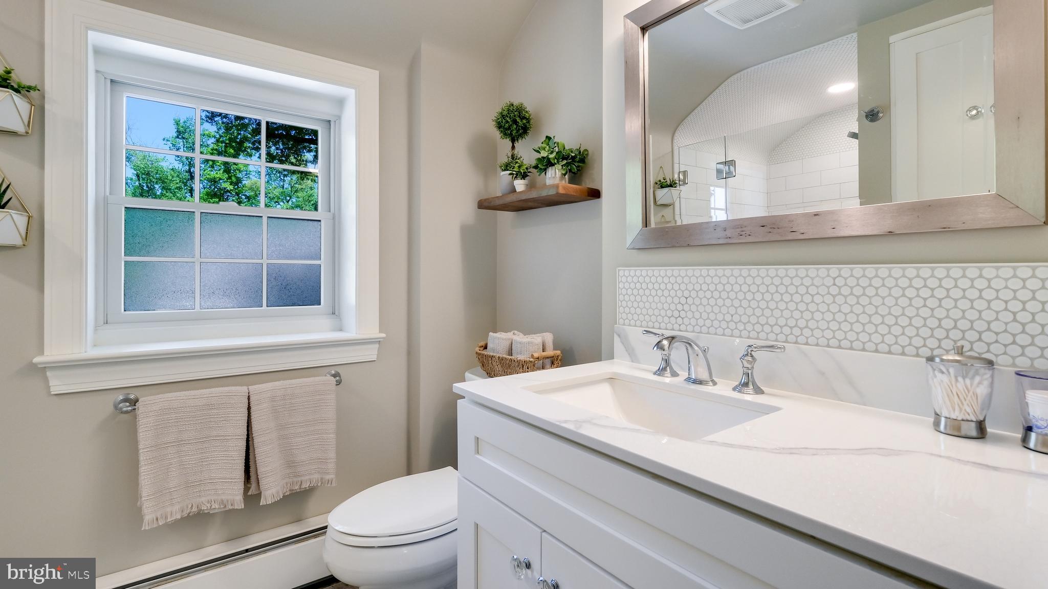 235 North Clinton Street Doylestown, PA 18901 - Photo 33 of 55 a bathroom with a sink a toilet and a window
