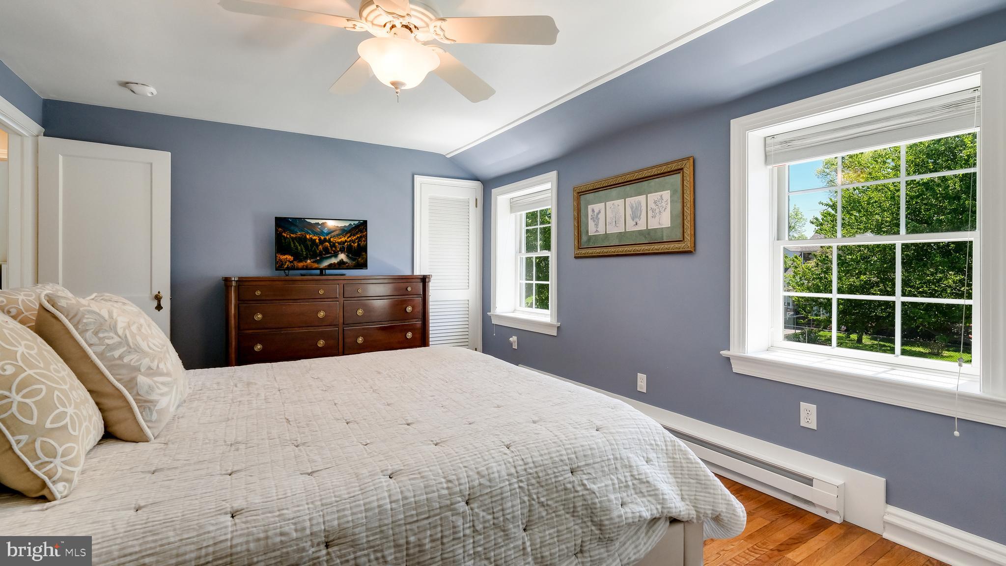 235 North Clinton Street Doylestown, PA 18901 - Photo 37 of 55 a bedroom with a bed and window with lamp