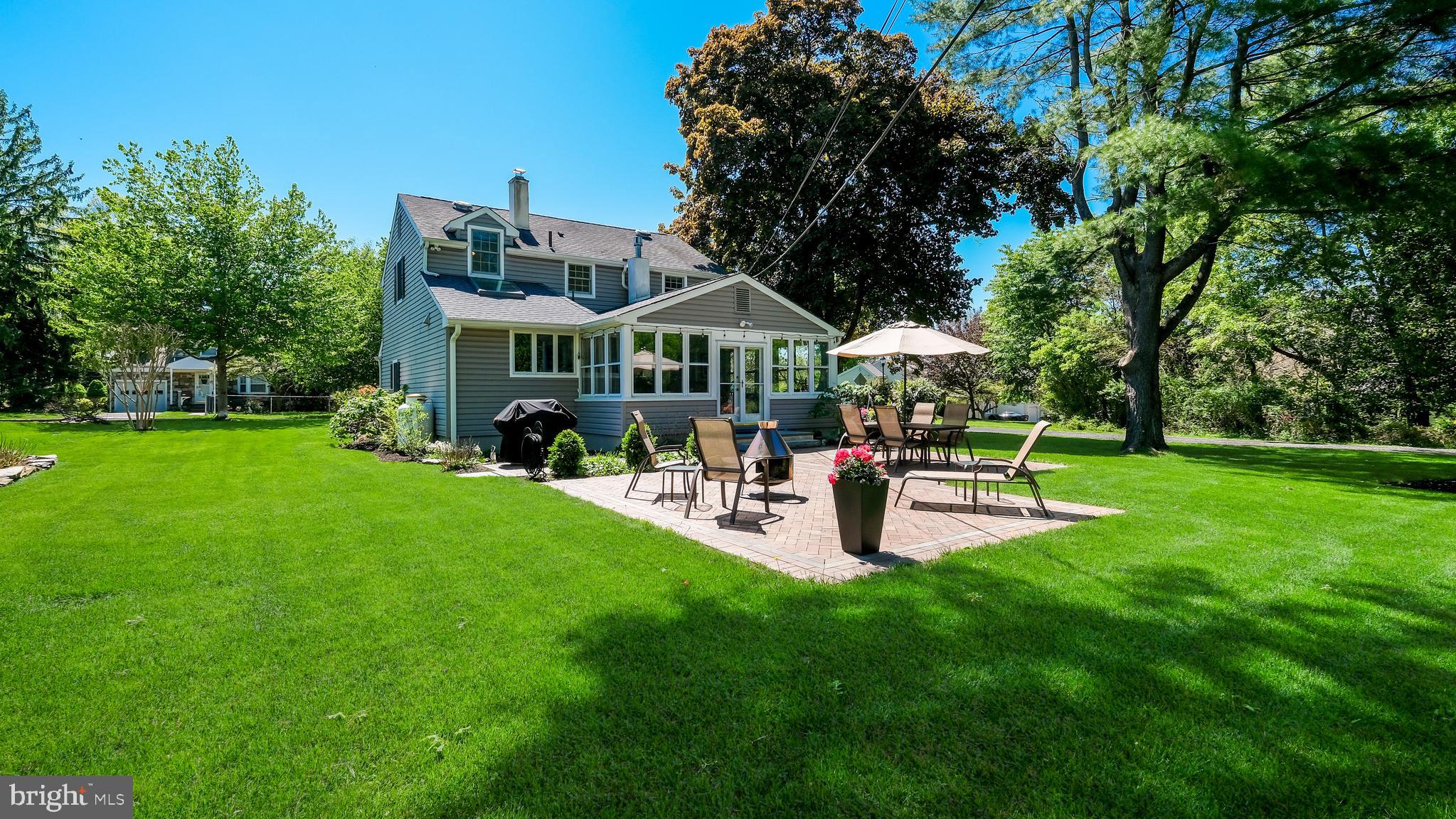 235 North Clinton Street Doylestown, PA 18901 - Photo 41 of 55 a view of a house with patio and a garden