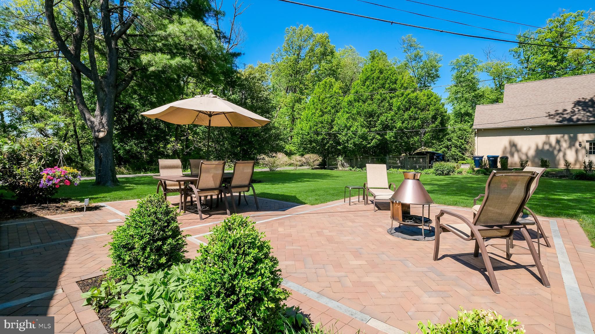 235 North Clinton Street Doylestown, PA 18901 - Photo 44 of 55 a view of a backyard with sitting area and garden