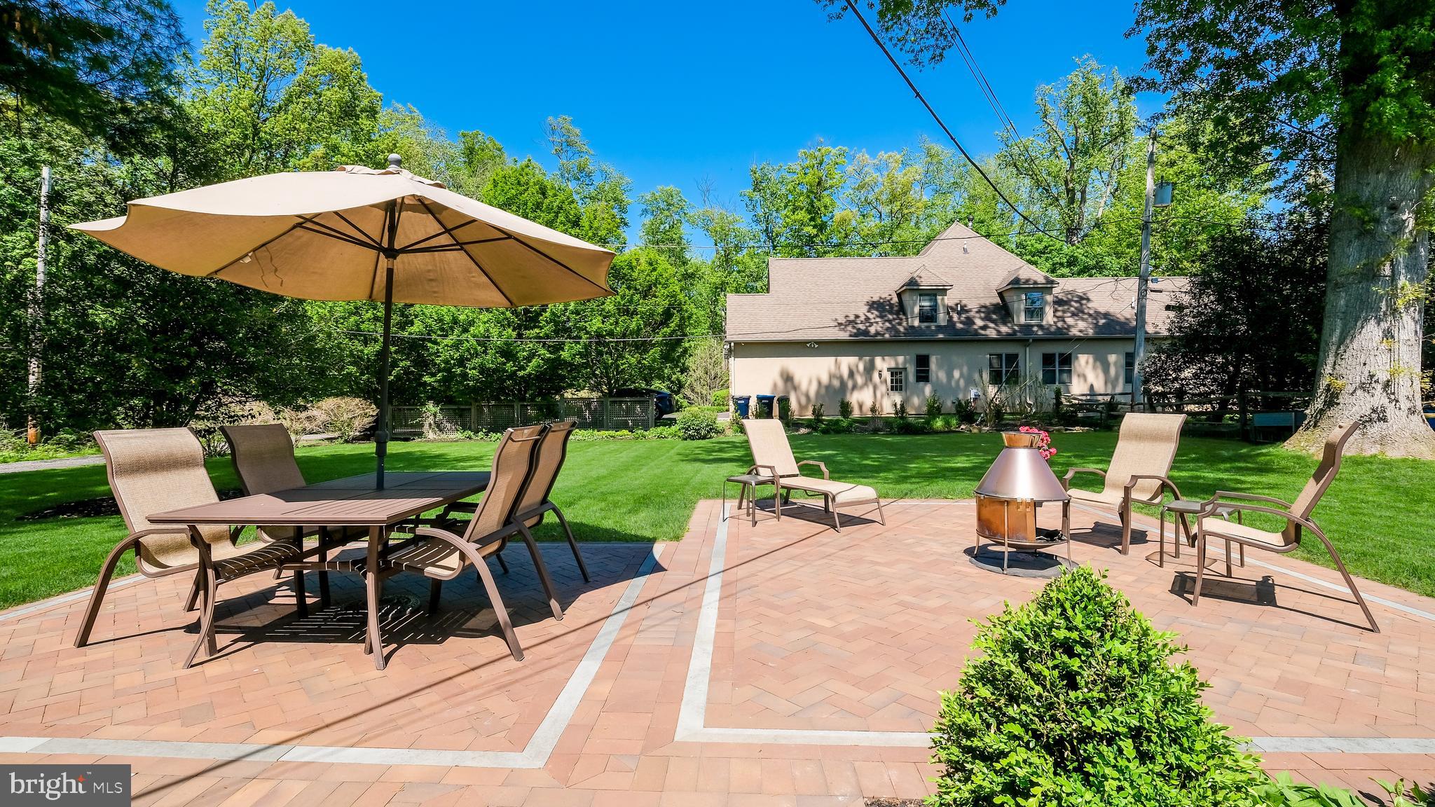 235 North Clinton Street Doylestown, PA 18901 - Photo 45 of 55 a view of backyard with outdoor seating and trees