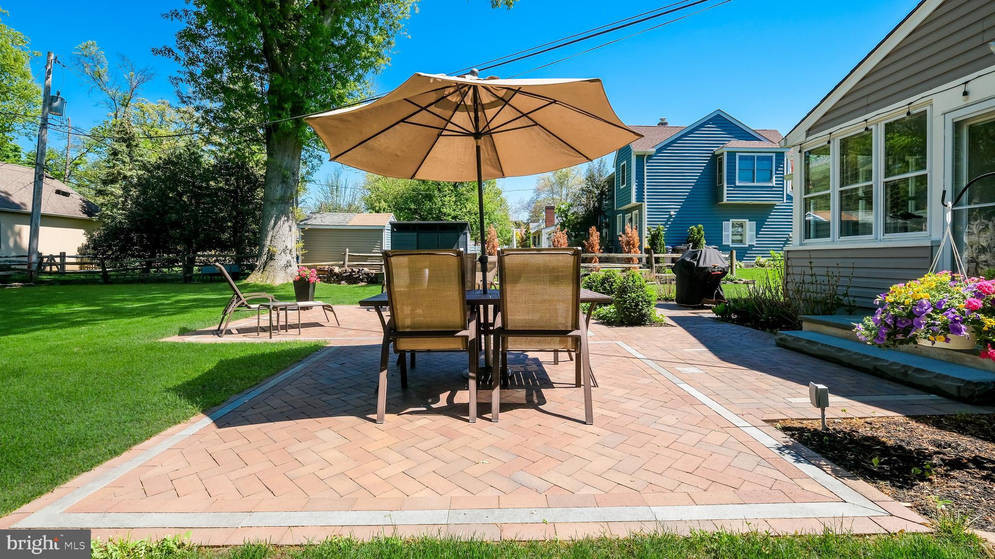 235 North Clinton Street Doylestown, PA 18901 - Photo 47 of 55 a view of a backyard with sitting area and slide
