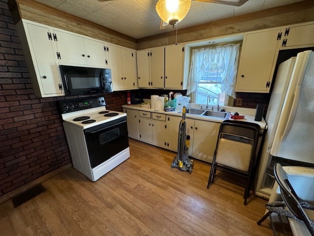 3 Highland Park Road Rutland, MA 01543 - Photo 9 of 25 a kitchen with a stove a sink and a refrigerator
