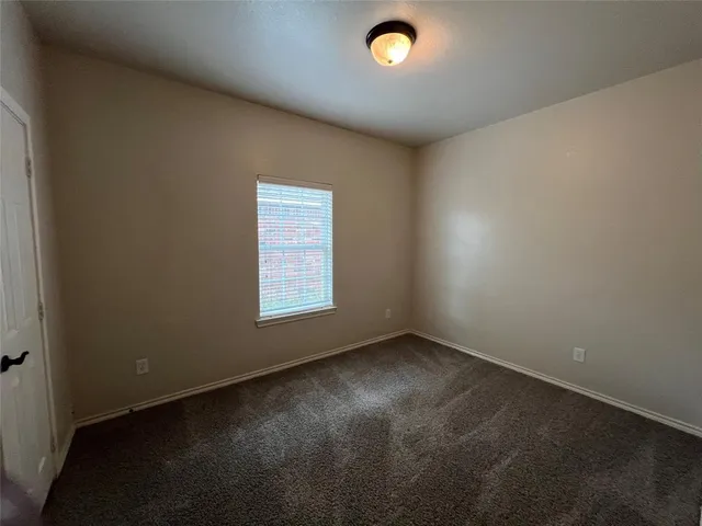 an empty room with a empty space and window