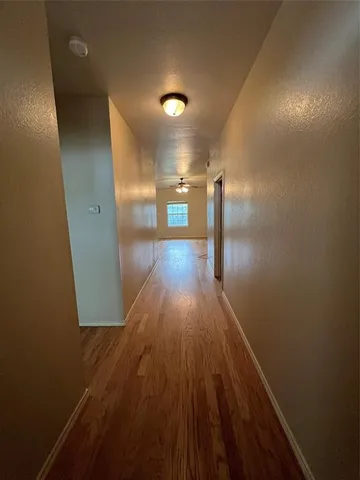 a view of gallery with wooden floor