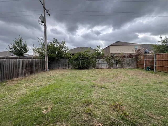 a view of a garden with a fence