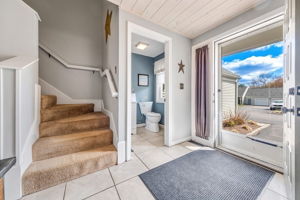 55 Stone Ridge Road, Unit 55 Franklin, MA 02038 - Photo 14 of 27 a view of entryway and hall with wooden floor