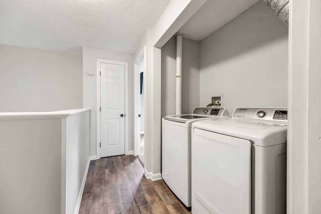 55 Stone Ridge Road, Unit 55 Franklin, MA 02038 - Photo 18 of 27 a view of storage and utility room with washer and dryer