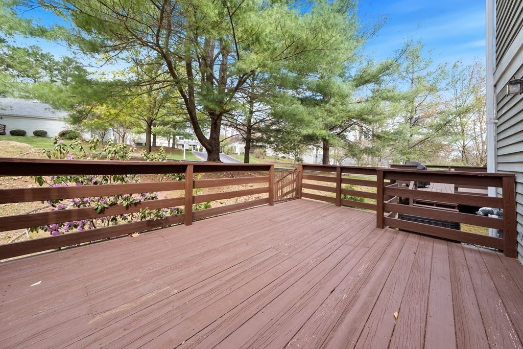 55 Stone Ridge Road, Unit 55 Franklin, MA 02038 - Photo 24 of 27 a view of outdoor space with seating