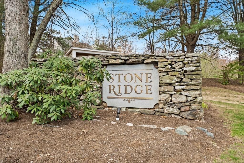 55 Stone Ridge Road, Unit 55 Franklin, MA 02038 - Photo 27 of 27 a sign on the side of a building