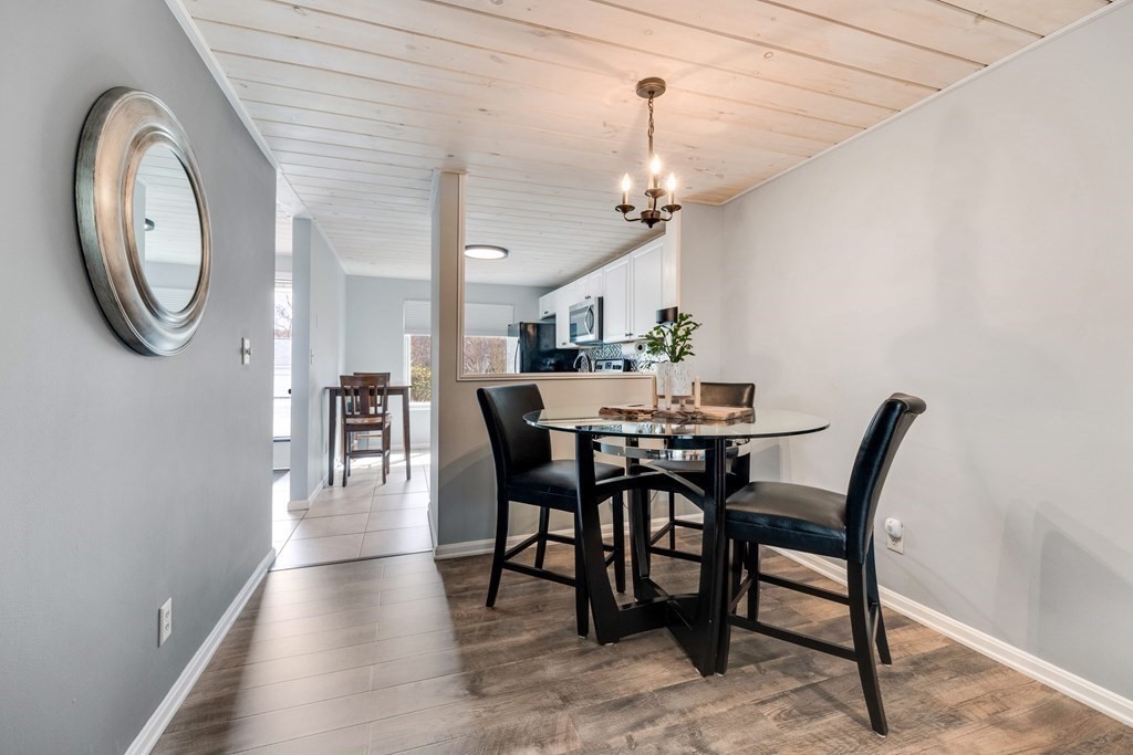 55 Stone Ridge Road, Unit 55 Franklin, MA 02038 - Photo 7 of 27 a view of a dining room with furniture