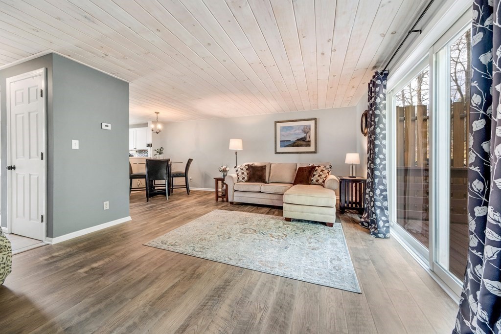 55 Stone Ridge Road, Unit 55 Franklin, MA 02038 - Photo 9 of 27 a living room with furniture and a table