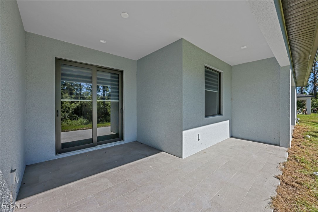 8771-8773 Buckingham Road Lehigh Acres, FL 33971 - Photo 17 of 34 a view of an empty room with a window