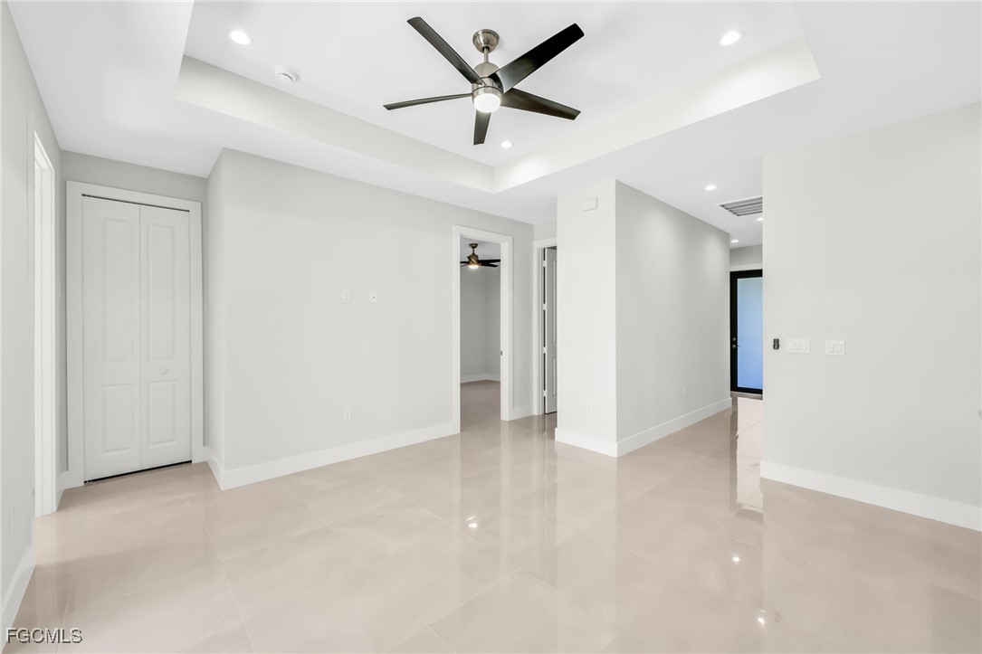 8771-8773 Buckingham Road Lehigh Acres, FL 33971 - Photo 26 of 34 an empty room with closet and a ceiling fan